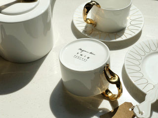 Cutlery Lifestyle Photo Cup and Saucer w/ Fork Handle Cut