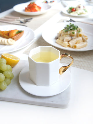 Cutlery Lifestyle Photo Cup and Saucer w/ Spoon Handle Focus